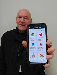 Councillor Robert Moran with the Healthy Happy Tots app